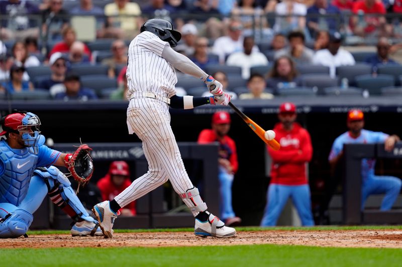 Aug 31, 2024; Bronx, New York, USA; New York Yankees third baseman Jazz Chisholm Jr. (13) hits a single against the St. Louis Cardinals during the sixth inning at Yankee Stadium. Mandatory Credit: Gregory Fisher-USA TODAY Sports