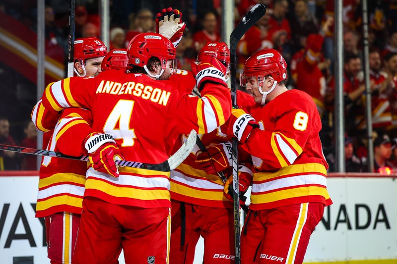 Jan 28, 2025; Calgary, Alberta, CAN; Calgary Flames center Blake Coleman (20) celebrates his goal with teammates against the Washington Capitals during the second period at Scotiabank Saddledome. Mandatory Credit: Sergei Belski-Imagn Images