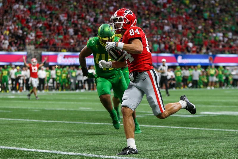 Sep 3, 2022; Atlanta, Georgia, USA; Georgia Bulldogs wide receiver Ladd McConkey (84) runs the ball for a touchdown against the Oregon Ducks in the first quarter at Mercedes-Benz Stadium. Mandatory Credit: Brett Davis-USA TODAY Sports
