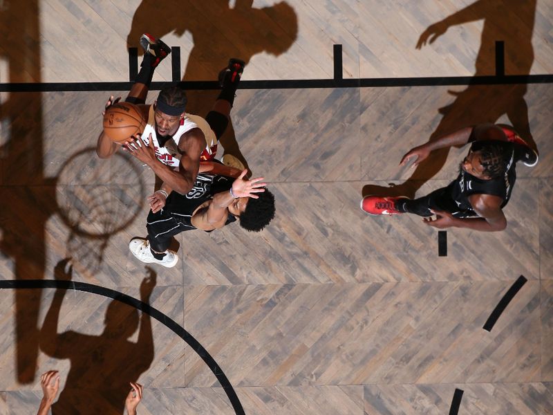 BROOKLYN, NY - JANUARY 15: Jimmy Butler #22 of the Miami Heat shoots the ball during the game against the Brooklyn Nets on January 15, 2024 at Barclays Center in Brooklyn, New York. NOTE TO USER: User expressly acknowledges and agrees that, by downloading and or using this Photograph, user is consenting to the terms and conditions of the Getty Images License Agreement. Mandatory Copyright Notice: Copyright 2024 NBAE (Photo by Nathaniel S. Butler/NBAE via Getty Images)