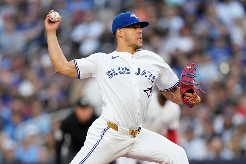 Jun 27, 2024; Toronto, Ontario, CAN; Toronto Blue Jays starting pitcher Jose Berrios (17) pitches to the New York Yankees during the second inning at Rogers Centre. Mandatory Credit: John E. Sokolowski-USA TODAY Sports