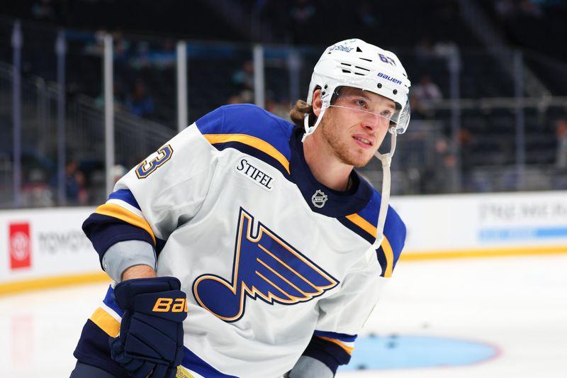 Oct 8, 2024; Seattle, Washington, USA; St. Louis Blues left wing Jake Neighbours (63) skates on the ice during warm ups before the game against the Seattle Kraken at Climate Pledge Arena. Mandatory Credit: Caean Couto-Imagn Images