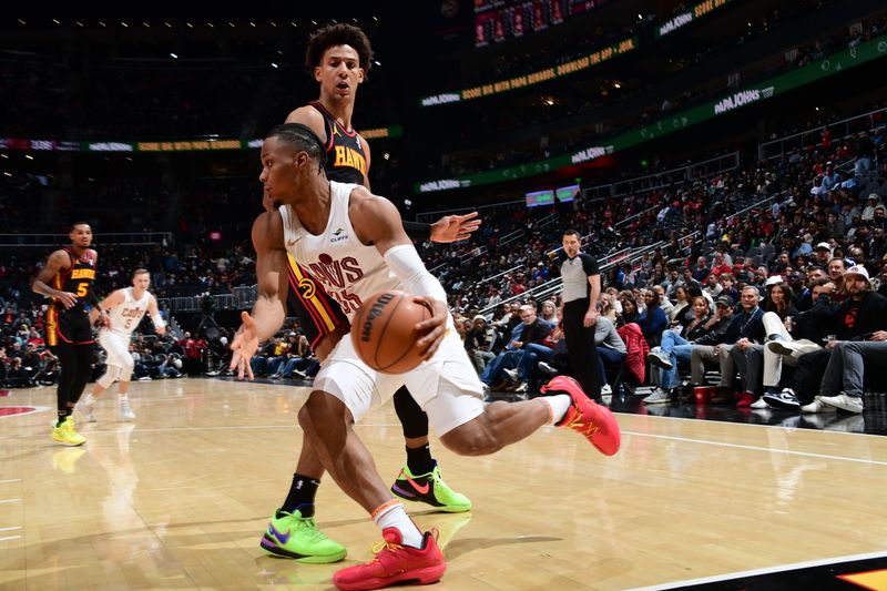 ATLANTA, GA - JANUARY 20: Isaac Okoro #35 of the Cleveland Cavaliers drives to the basket during the game against the Atlanta Hawks on January 20, 2024 at State Farm Arena in Atlanta, Georgia.  NOTE TO USER: User expressly acknowledges and agrees that, by downloading and/or using this Photograph, user is consenting to the terms and conditions of the Getty Images License Agreement. Mandatory Copyright Notice: Copyright 2024 NBAE (Photo by Scott Cunningham/NBAE via Getty Images)