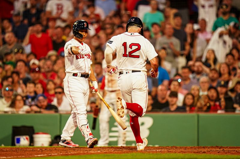 Jul 23, 2023; Boston, Massachusetts, USA; Boston Red Sox catcher Connor Wong (12) scores on a wild pitch by New York Mets relief pitcher Drew Smith (40) (not pictured)  in the third inning at Fenway Park. Mandatory Credit: David Butler II-USA TODAY Sports