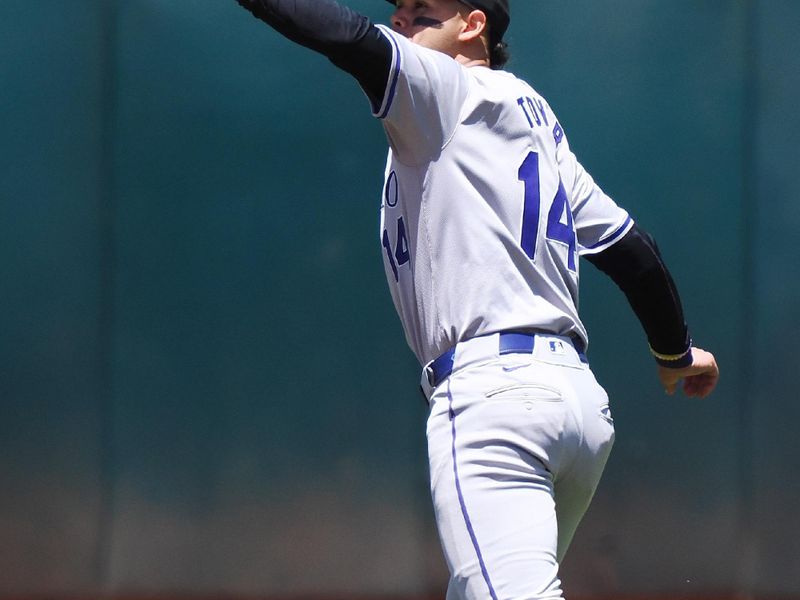 May 23, 2024; Oakland, California, USA; Colorado Rockies shortstop Ezequiel Tovar (14) catches the ball against the Oakland Athletics during the third inning at Oakland-Alameda County Coliseum. Mandatory Credit: Kelley L Cox-USA TODAY Sports