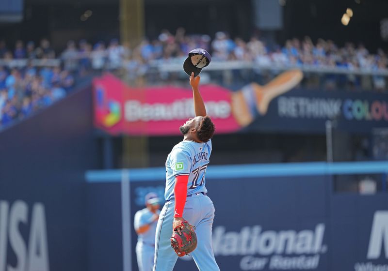 Aug 25, 2024; Toronto, Ontario, CAN; Toronto Blue Jays first base Vladimir Guerrero Jr. (27) celebrates the win against the Los Angeles Angels at the end of the ninth inning at Rogers Centre. Mandatory Credit: Nick Turchiaro-USA TODAY Sports