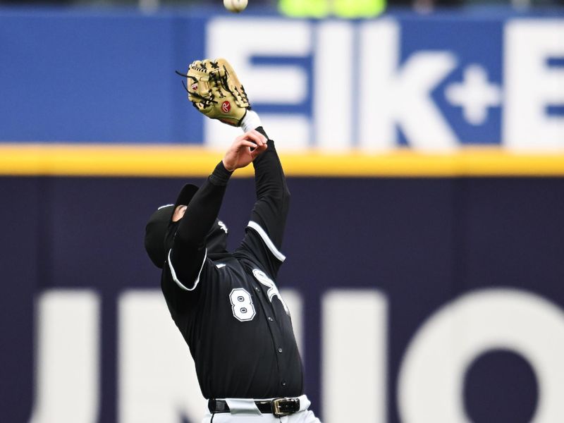 Apr 10, 2025; Cleveland, Ohio, USA; Chicago White Sox shortstop Jacob Amaya (8) catches a ball hit by Cleveland Guardians second baseman Daniel Schneemann (not pictured) during the second inning at Progressive Field. Mandatory Credit: Ken Blaze-Imagn Images