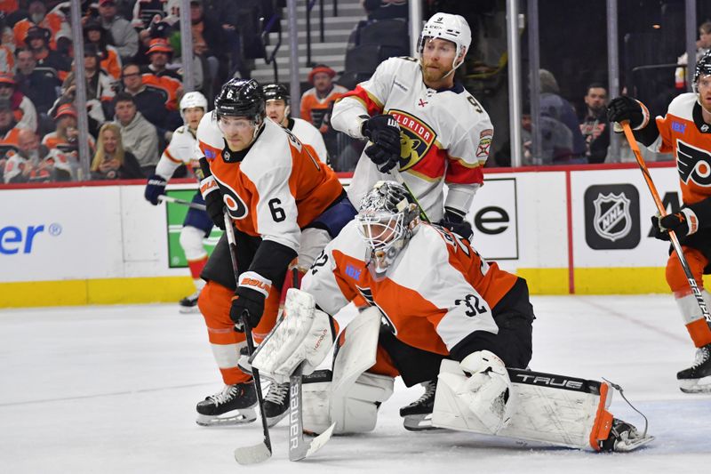 Mar 24, 2024; Philadelphia, Pennsylvania, USA; Philadelphia Flyers defenseman Travis Sanheim (6) battles with Florida Panthers center Sam Bennett (9) against goaltender Felix Sandstrom (32) during the second period at Wells Fargo Center. Mandatory Credit: Eric Hartline-USA TODAY Sports