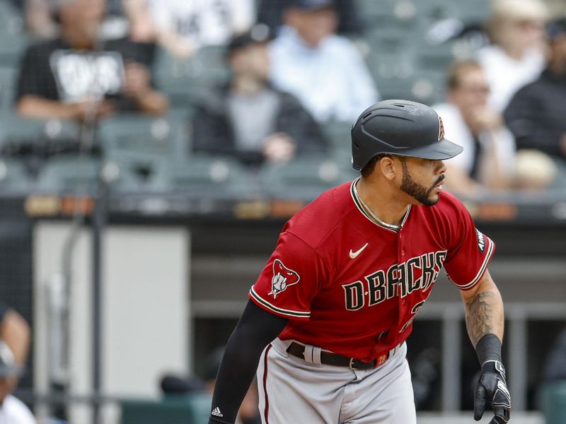 Sep 27, 2023; Chicago, Illinois, USA; Arizona Diamondbacks left fielder Tommy Pham (28) watches his RBI-single against the Chicago White Sox during the third inning at Guaranteed Rate Field. Mandatory Credit: Kamil Krzaczynski-USA TODAY Sports