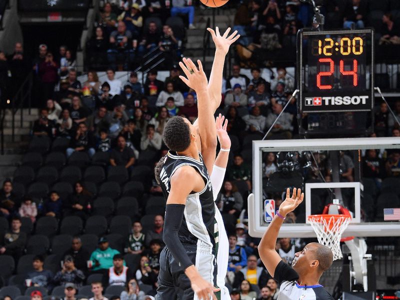 SAN ANTONIO, TX - JANUARY 4: Victor Wembanyama #1 of the San Antonio Spurs goes for the opening tip off during the game against the Milwaukee Bucks on January 4, 2024 at the Frost Bank Center in San Antonio, Texas. NOTE TO USER: User expressly acknowledges and agrees that, by downloading and or using this photograph, user is consenting to the terms and conditions of the Getty Images License Agreement. Mandatory Copyright Notice: Copyright 2024 NBAE (Photos by Michael Gonzales/NBAE via Getty Images)