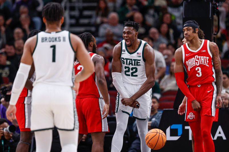 Mar 10, 2023; Chicago, IL, USA; Michigan State Spartans center Mady Sissoko (22) reacts after scoring against the Ohio State Buckeyes during the first half at United Center. Mandatory Credit: Kamil Krzaczynski-USA TODAY Sports