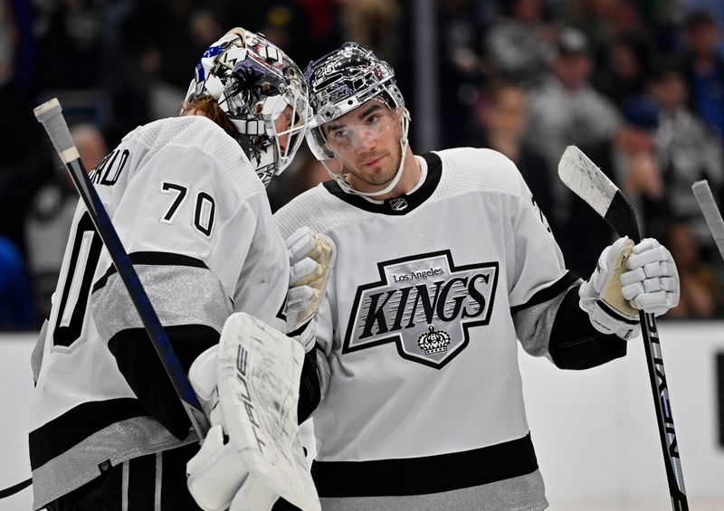 Apr 10, 2023; Los Angeles, California, USA;  Los Angeles Kings goaltender Joonas Korpisalo (70) is congratulated by Los Angeles Kings defenseman Sean Walker (26) after defeating the Vancouver Canucks at Crypto.com Arena. Mandatory Credit: Jayne Kamin-Oncea-USA TODAY Sports