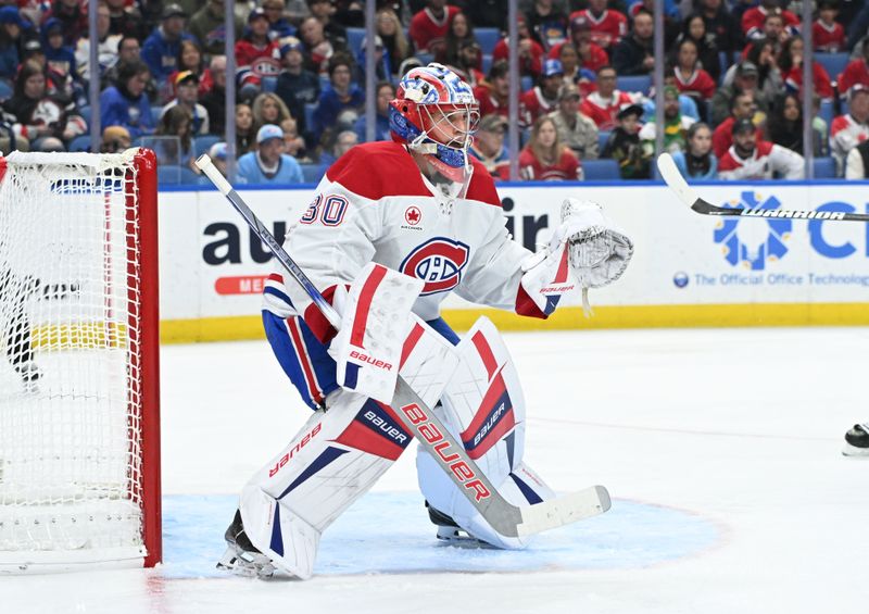 Nov 11, 2024; Buffalo, New York, USA; Montreal Canadiens goaltender Cayden Primeau (30) prepares to defend a shot bt the Buffalo Sabres in the second period at KeyBank Center. Mandatory Credit: Mark Konezny-Imagn Images