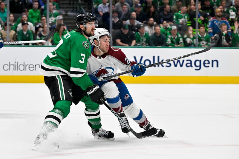 May 9, 2024; Dallas, Texas, USA; Dallas Stars defenseman Chris Tanev (3) and Colorado Avalanche center Ross Colton (20) battle for position in the Stars zone during the third period in game two of the second round of the 2024 Stanley Cup Playoffs at American Airlines Center. Mandatory Credit: Jerome Miron-USA TODAY Sports