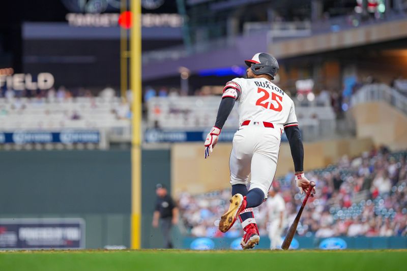 May 6, 2025; Minneapolis, Minnesota, USA; Minnesota Twins outfielder Byron Buxton (25) hits a home run against the Baltimore Orioles in the seventh inning at Target Field. Mandatory Credit: Brad Rempel-Imagn Images