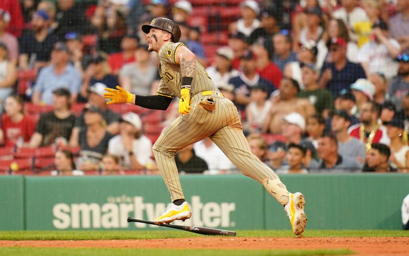 Jun 30, 2024; Boston, Massachusetts, USA; San Diego Padres center fielder Jackson Merrill (3) hits a double against them Boston Red Sox in the seventh inning at Fenway Park. Mandatory Credit: David Butler II-USA TODAY Sports