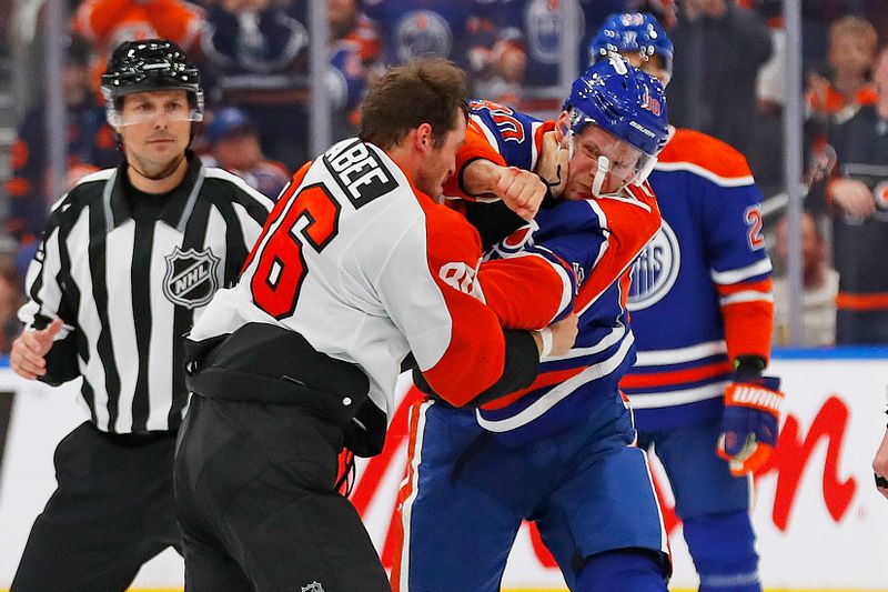 Oct 15, 2024; Edmonton, Alberta, CAN; Edmonton Oilers forward Corey Perry (90) and Philadelphia Flyers forward Joel Farabee (86) fight during the third period at Rogers Place. Mandatory Credit: Perry Nelson-Imagn Images