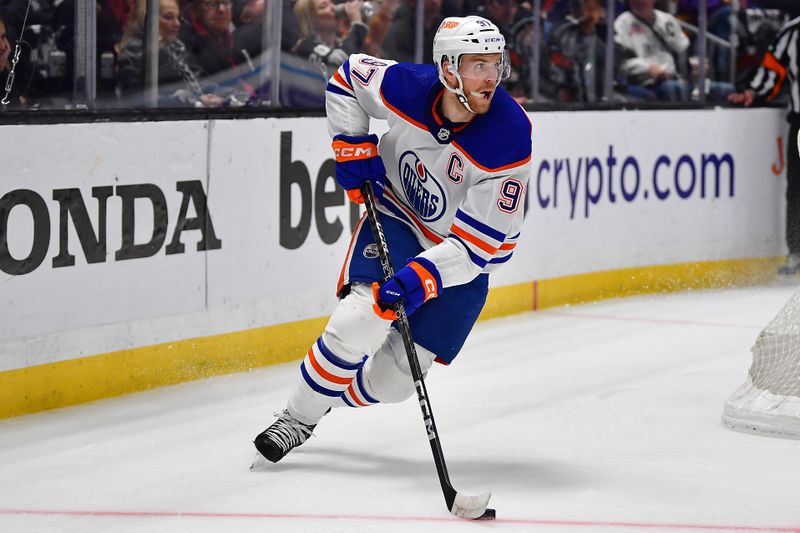 Apr 29, 2023; Los Angeles, California, USA; Edmonton Oilers center Connor McDavid (97) moves the puck against the Los Angeles Kings during the first period in game six of the first round of the 2023 Stanley Cup Playoffs at Crypto.com Arena. Mandatory Credit: Gary A. Vasquez-USA TODAY Sports