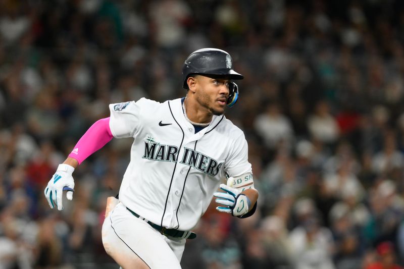 Sep 11, 2023; Seattle, Washington, USA; Seattle Mariners center fielder Julio Rodriguez (44) runs towards first base after hitting a double against the Los Angeles Angels during the sixth inning at T-Mobile Park. Mandatory Credit: Steven Bisig-USA TODAY Sports