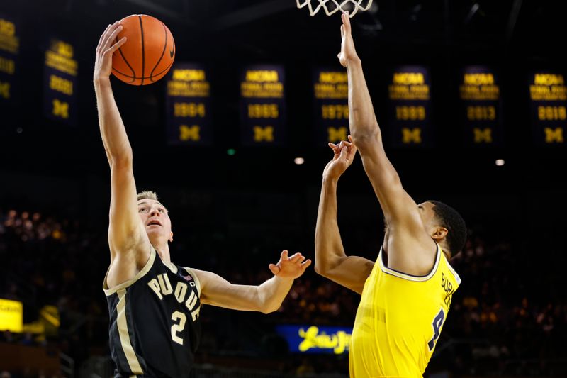 Feb 25, 2024; Ann Arbor, Michigan, USA;  Purdue Boilermakers guard Fletcher Loyer (2) shoots on Michigan Wolverines guard Nimari Burnett (4) in the second half at Crisler Center. Mandatory Credit: Rick Osentoski-USA TODAY Sports