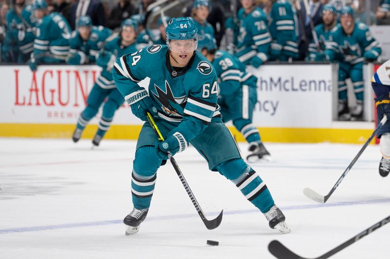 Oct 10, 2024; San Jose, California, USA; San Jose Sharks center Mikael Granlund (64) controls the puck during the first period against the St. Louis Blues at SAP Center at San Jose. Mandatory Credit: Stan Szeto-Imagn Images