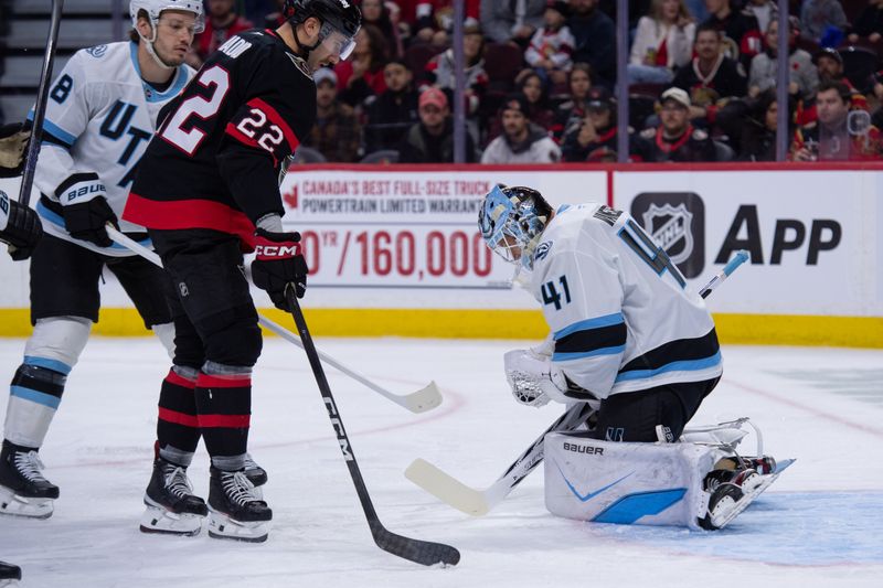 Nov 9, 2025; Ottawa, Ontario, CAN; Utah Mammoth goalie Vitek Vanacek (41) makes a save in front of Ottawa Senators right wing Michael Amadio (22) in the first period at the Canadian Tire Centre. Mandatory Credit: Marc DesRosiers-IMAGN Images
