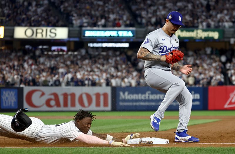 Oct 30, 2024; New York, New York, USA; Los Angeles Dodgers pitcher Anthony Banda (43) forces out New York Yankees third baseman Jazz Chisholm Jr. (13) during the second inning in game five of the 2024 MLB World Series at Yankee Stadium. Mandatory Credit: Vincent Carchietta-Imagn Images