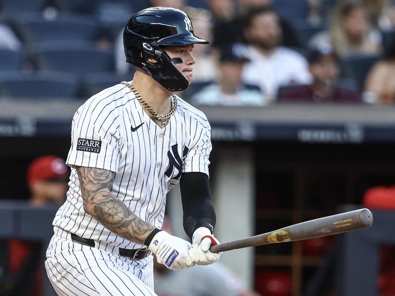 Jul 3, 2024; Bronx, New York, USA; New York Yankees left fielder Alex Verdugo (24) hits a single in the second inning against the Cincinnati Reds at Yankee Stadium. Mandatory Credit: Wendell Cruz-USA TODAY Sports