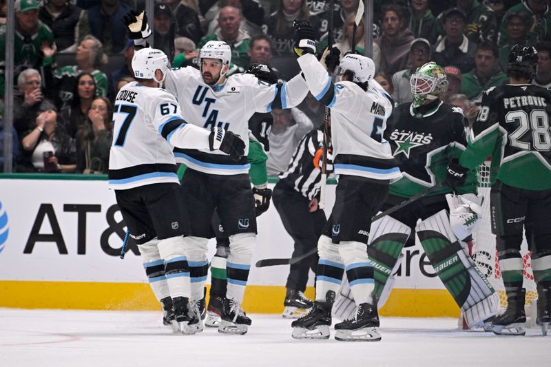 Nov 28, 2025; Dallas, Texas, USA; Utah Mammoth center Jack McBain (22) and defenseman Nick DeSimone (57) and defenseman John Marino (6) celebrates after McBain scores a goal against Dallas Stars goaltender Jake Oettinger (29) during the second period at the American Airlines Center. Mandatory Credit: Jerome Miron-Imagn Images