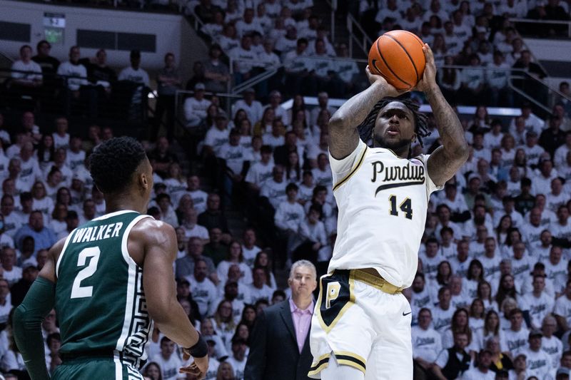 Jan 29, 2023; West Lafayette, Indiana, USA; Purdue Boilermakers guard David Jenkins Jr. (14) shoots the ball while Michigan State Spartans guard Tyson Walker (2) defends in the second half at Mackey Arena. Mandatory Credit: Trevor Ruszkowski-USA TODAY Sports