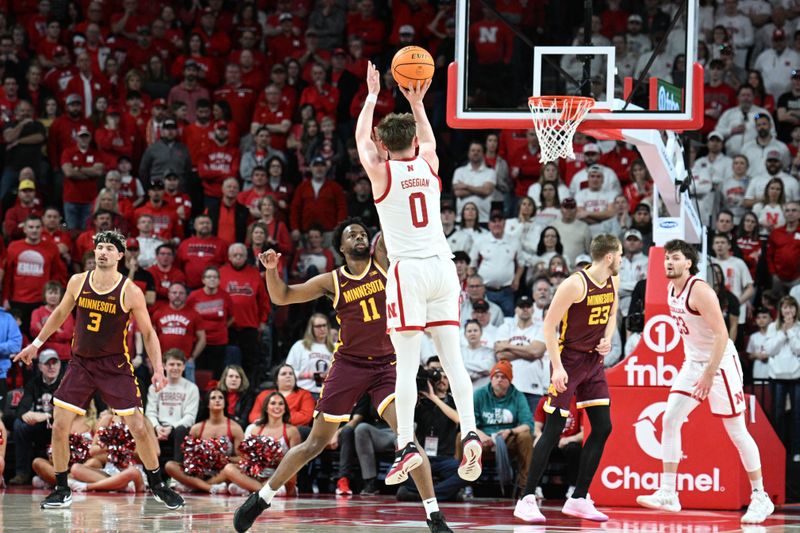 Mar 1, 2025; Lincoln, Nebraska, USA;  Nebraska Cornhuskers guard Connor Essegian (0) scores on a three point shot against the Minnesota Golden Gophers during the second half at Pinnacle Bank Arena. Mandatory Credit: Steven Branscombe-Imagn Images