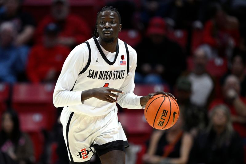 Nov 27, 2023; San Diego, California, USA; San Diego State Aztecs forward Jay Pal (4) dribbles the ball during the first half against the Point Loma Nazarene Sea Lions at Viejas Arena. Mandatory Credit: Orlando Ramirez-USA TODAY Sports