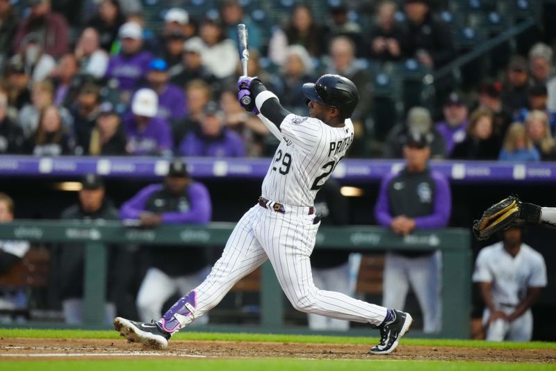 May 12, 2023; Denver, Colorado, USA; Colorado Rockies left fielder Jurickson Profar (29) doubles in the sixth inning against the Philadelphia Phillies at Coors Field. Mandatory Credit: Ron Chenoy-USA TODAY Sports