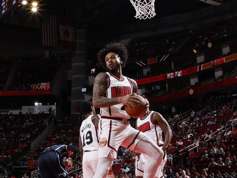 HOUSTON, TX - MARCH 10: Cam Whitmore #7 of the Houston Rockets rebounds the ball during the game against the Orlando Magic on March 10, 2025 at the Toyota Center in Houston, Texas. NOTE TO USER: User expressly acknowledges and agrees that, by downloading and or using this photograph, User is consenting to the terms and conditions of the Getty Images License Agreement. Mandatory Copyright Notice: Copyright 2025 NBAE (Photo by Logan Riely/NBAE via Getty Images)