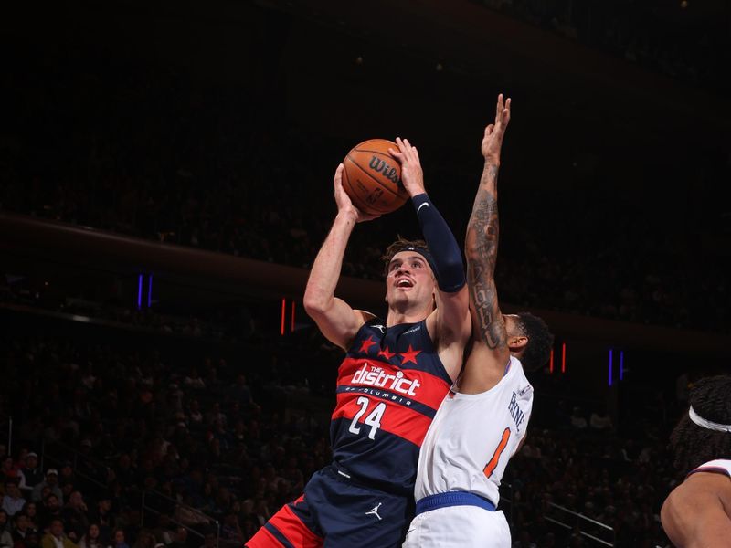 NEW YORK, NY - NOVEMBER 18: Corey Kispert #24 of the Washington Wizards drives to the basket during the game against the New York Knicks on November 18, 2024 at Madison Square Garden in New York City, New York.  NOTE TO USER: User expressly acknowledges and agrees that, by downloading and or using this photograph, User is consenting to the terms and conditions of the Getty Images License Agreement. Mandatory Copyright Notice: Copyright 2024 NBAE  (Photo by Nathaniel S. Butler/NBAE via Getty Images)