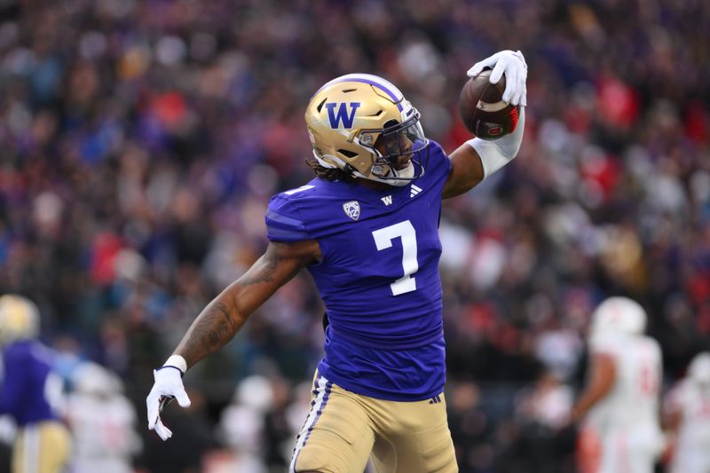 Nov 11, 2023; Seattle, Washington, USA; Washington Huskies cornerback Dominique Hampton (7) celebrates after a defensive play against the Utah Utes during the second half at Alaska Airlines Field at Husky Stadium. Mandatory Credit: Steven Bisig-USA TODAY Sports