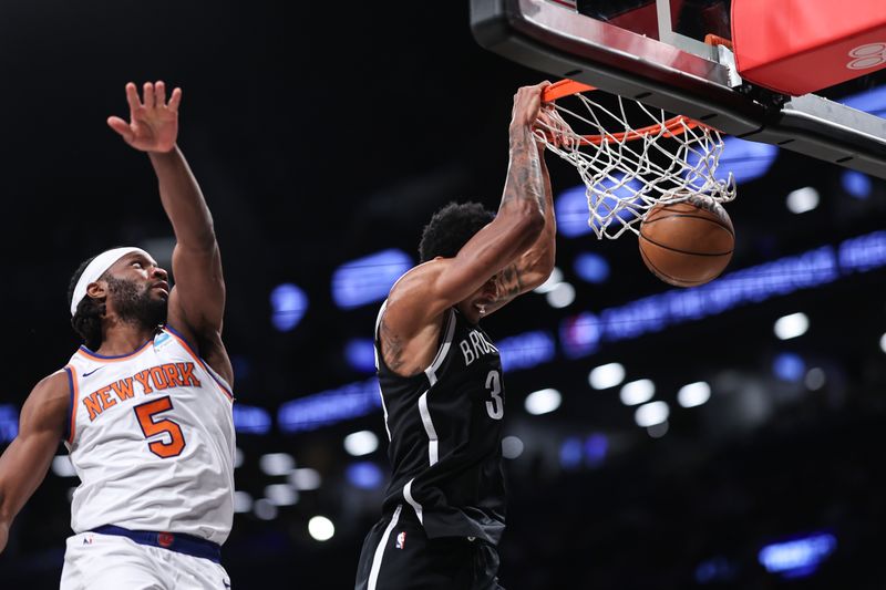 NEW YORK, NEW YORK - JANUARY 23: Nic Claxton #33 of the Brooklyn Nets dunks the ball during the second quarter of the game against the New York Knicks at Barclays Center on January 23, 2024 in New York City.  NOTE TO USER: User expressly acknowledges and agrees that, by downloading and or using this photograph, User is consenting to the terms and conditions of the Getty Images License Agreement. (Photo by Dustin Satloff/Getty Images)