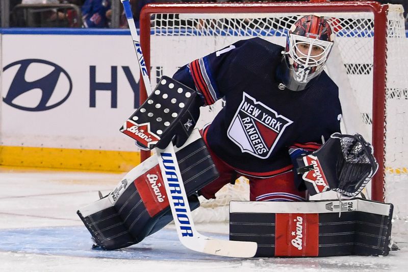 Dec 23, 2023; New York, New York, USA; New York Rangers goaltender Igor Shesterkin (31) makes a save against the Buffalo Sabres during the second period at Madison Square Garden. Mandatory Credit: Dennis Schneidler-USA TODAY Sports