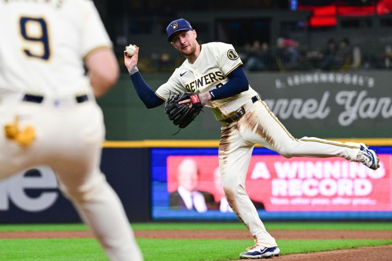 Apr 17, 2024; Milwaukee, Wisconsin, USA; Milwaukee Brewers second baseman Brice Turang (2) throws out San Diego Padres left fielder Jurickson Profar (not pictured) in the ninth inning at American Family Field. Mandatory Credit: Benny Sieu-USA TODAY Sports