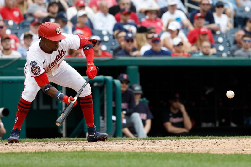 Apr 16, 2023; Washington, District of Columbia, USA; Washington Nationals center fielder Victor Robles (16) hit a sacrifice bunt against the Cleveland Guardians during the eighth inning at Nationals Park. Mandatory Credit: Geoff Burke-USA TODAY Sports