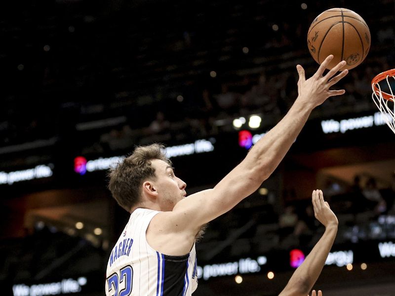 NEW ORLEANS, LOUISIANA - MARCH 13: Franz Wagner #22 of the Orlando Magic shoots over Trey Murphy III #25 of the New Orleans Pelicans during the first half of a game at the Smoothie King Center on March 13, 2025 in New Orleans, Louisiana. NOTE TO USER: User expressly acknowledges and agrees that, by downloading and or using this photograph, User is consenting to the terms and conditions of the Getty Images License Agreement. (Photo by Derick E. Hingle/Getty Images)