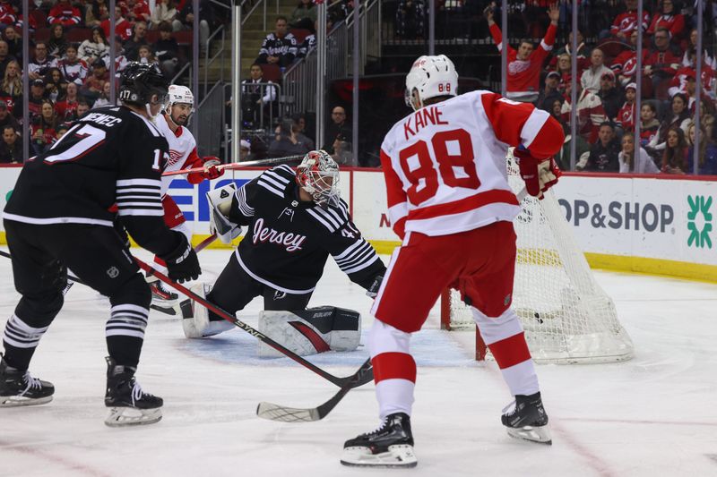 Dec 23, 2023; Newark, New Jersey, USA; Detroit Red Wings right wing Patrick Kane (88) scores a goal on New Jersey Devils goaltender Vitek Vanecek (41) during the first period at Prudential Center. Mandatory Credit: Ed Mulholland-USA TODAY Sports