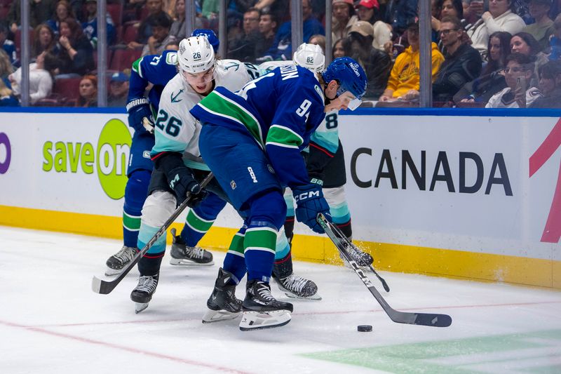 Sep 24, 2024; Vancouver, British Columbia, CAN; Seattle Kraken forward Ryan Winterton (26) battles with Vancouver Canucks forward Linus Karlsson (94) during the second period at Rogers Arena. Mandatory Credit: Bob Frid-Imagn Images