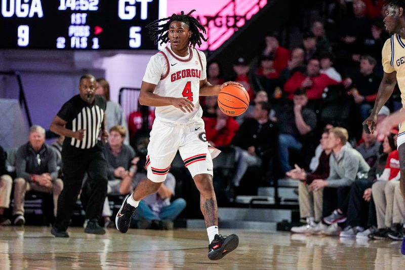 Dec 5, 2023; Athens, Georgia, USA; Georgia Bulldogs guard Silas Demary Jr. (4) brings the ball up the court against the Georgia Tech Yellow Jackets at Stegeman Coliseum. Mandatory Credit: Dale Zanine-USA TODAY Sports