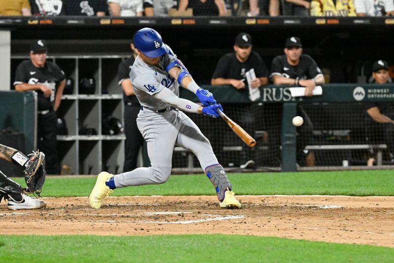 Jun 24, 2024; Chicago, Illinois, USA;  Los Angeles Dodgers third base Enrique Hernández (8) hits an RBI double against the Chicago White Sox during the seventh inning at Guaranteed Rate Field. Mandatory Credit: Matt Marton-USA TODAY Sports