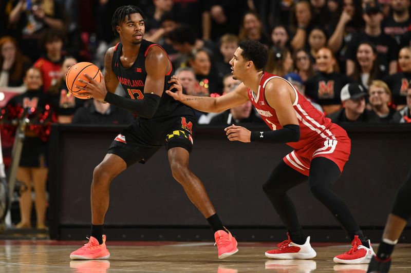 Jan 25, 2023; College Park, Maryland, USA;  Maryland Terrapins guard Hakim Hart (13) looks to move the ball as Wisconsin Badgers guard Jordan Davis (2) defends during the first half at Xfinity Center. Mandatory Credit: Tommy Gilligan-USA TODAY Sports