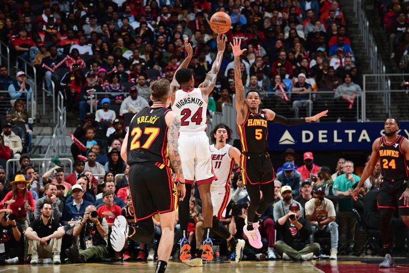 ATLANTA, GA - APRIL 9: Dejounte Murray #5 of the Atlanta Hawks plays defense during the game against the Miami Heat on April 9, 2024 at State Farm Arena in Atlanta, Georgia.  NOTE TO USER: User expressly acknowledges and agrees that, by downloading and/or using this Photograph, user is consenting to the terms and conditions of the Getty Images License Agreement. Mandatory Copyright Notice: Copyright 2024 NBAE (Photo by Scott Cunningham/NBAE via Getty Images)