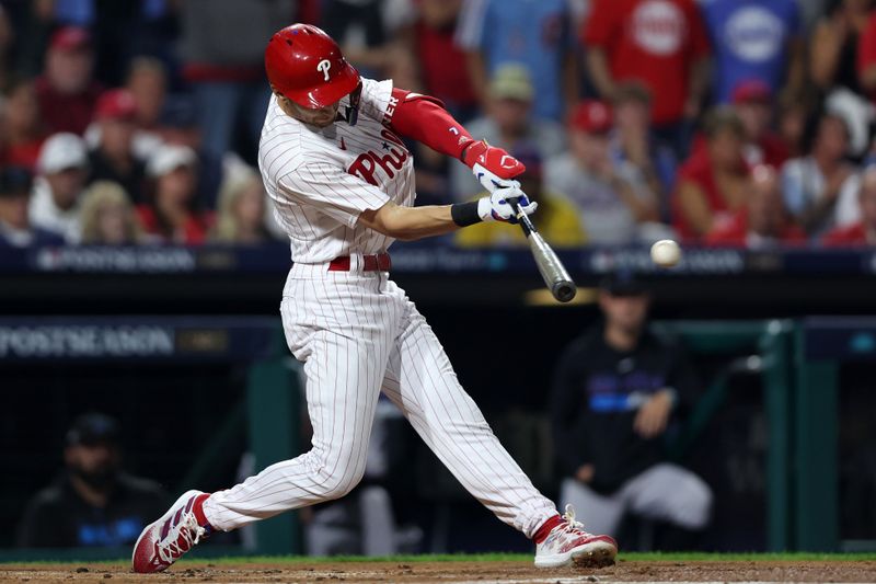 Oct 3, 2023; Philadelphia, Pennsylvania, USA; Philadelphia Phillies shortstop Trea Turner (7) hits a double against the Miami Marlins in the first inning for game one of the Wildcard series for the 2023 MLB playoffs at Citizens Bank Park. Mandatory Credit: Bill Streicher-USA TODAY Sports