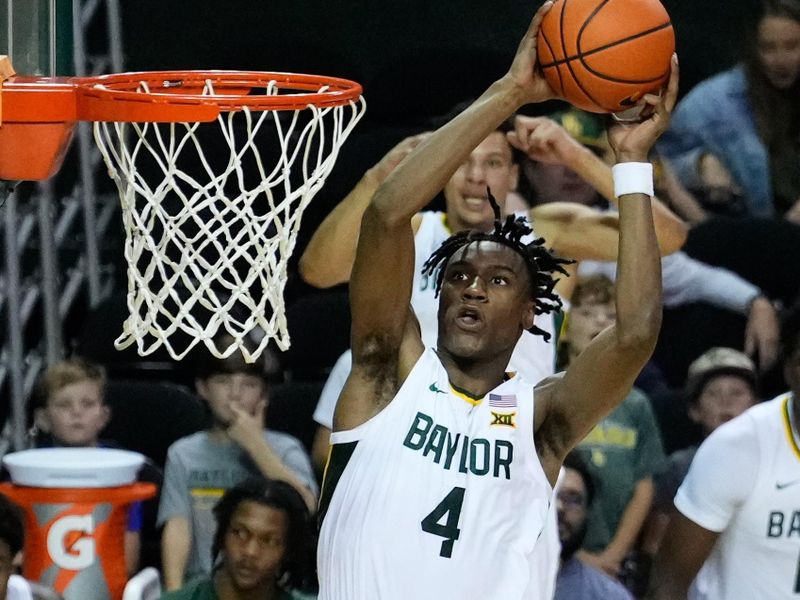 Nov 28, 2023; Waco, Texas, USA;  Baylor Bears guard Ja'Kobe Walter (4) dunks against the Nicholls State Colonels during the second half at Ferrell Center. Mandatory Credit: Chris Jones-USA TODAY Sports