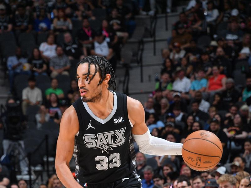 SAN ANTONIO, TX - APRIL 7: Tre Jones #33 of the San Antonio Spurs dribbles the ball during the game against the Philadelphia 76ers on April 7, 2024 at the Frost Bank Center in San Antonio, Texas. NOTE TO USER: User expressly acknowledges and agrees that, by downloading and or using this photograph, user is consenting to the terms and conditions of the Getty Images License Agreement. Mandatory Copyright Notice: Copyright 2024 NBAE (Photos by Michael Gonzales/NBAE via Getty Images)